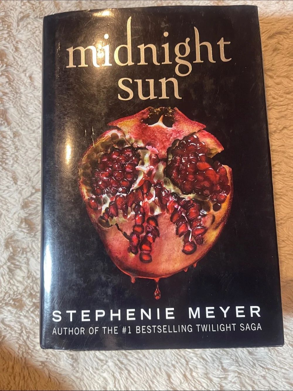 Midnight Sun by Stephenie Meyer - Black Cover with Red Pomegranate Artwork